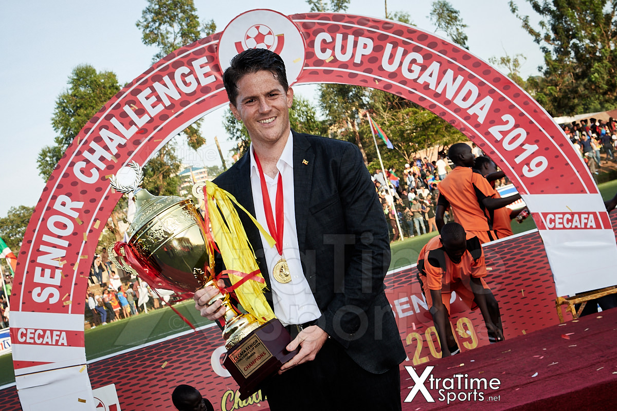 Coach McKinstry (Head Coach, Uganda) with the 2019 CECAFA Senior Challenge Cup.   Photo: XtraTimeSports (Darren McKinstry)